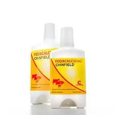 YODACALCIO MG magnesium supplement for camels and livestock in white and yellow bottles. Supports growth, metabolism, and reproduction in animals.