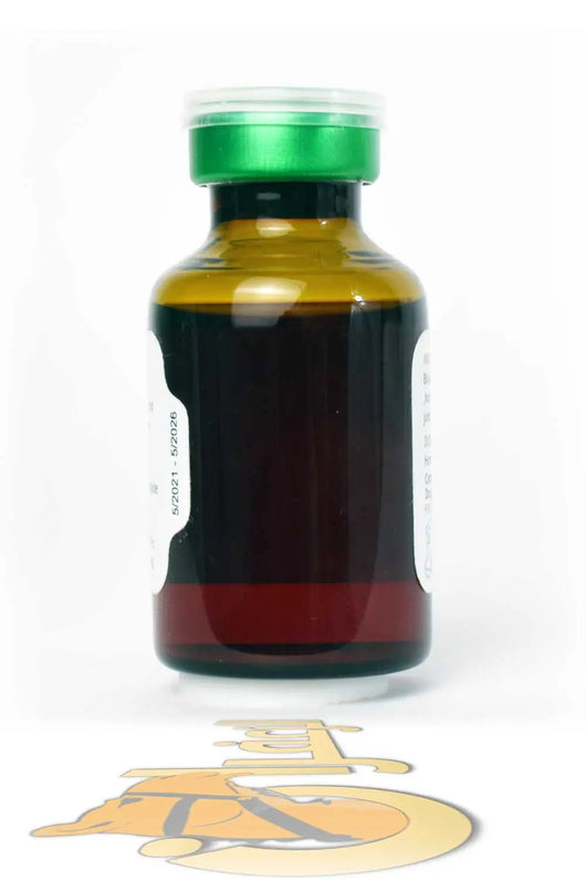 Side view of BLOCKER MAX 20ml veterinary injectable bottle, dark amber glass with green cap, used for joint pain in animals.